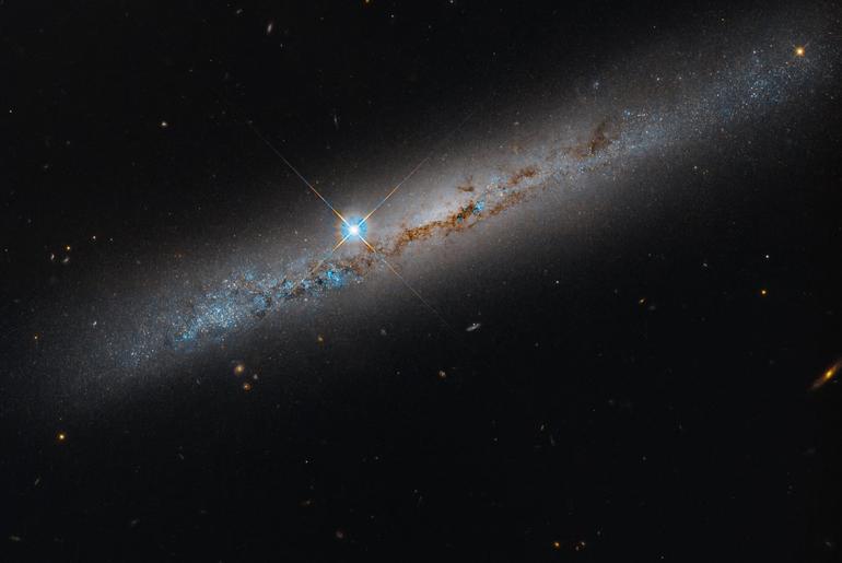 NASA’s Hubble Spies Spiral’s Edge